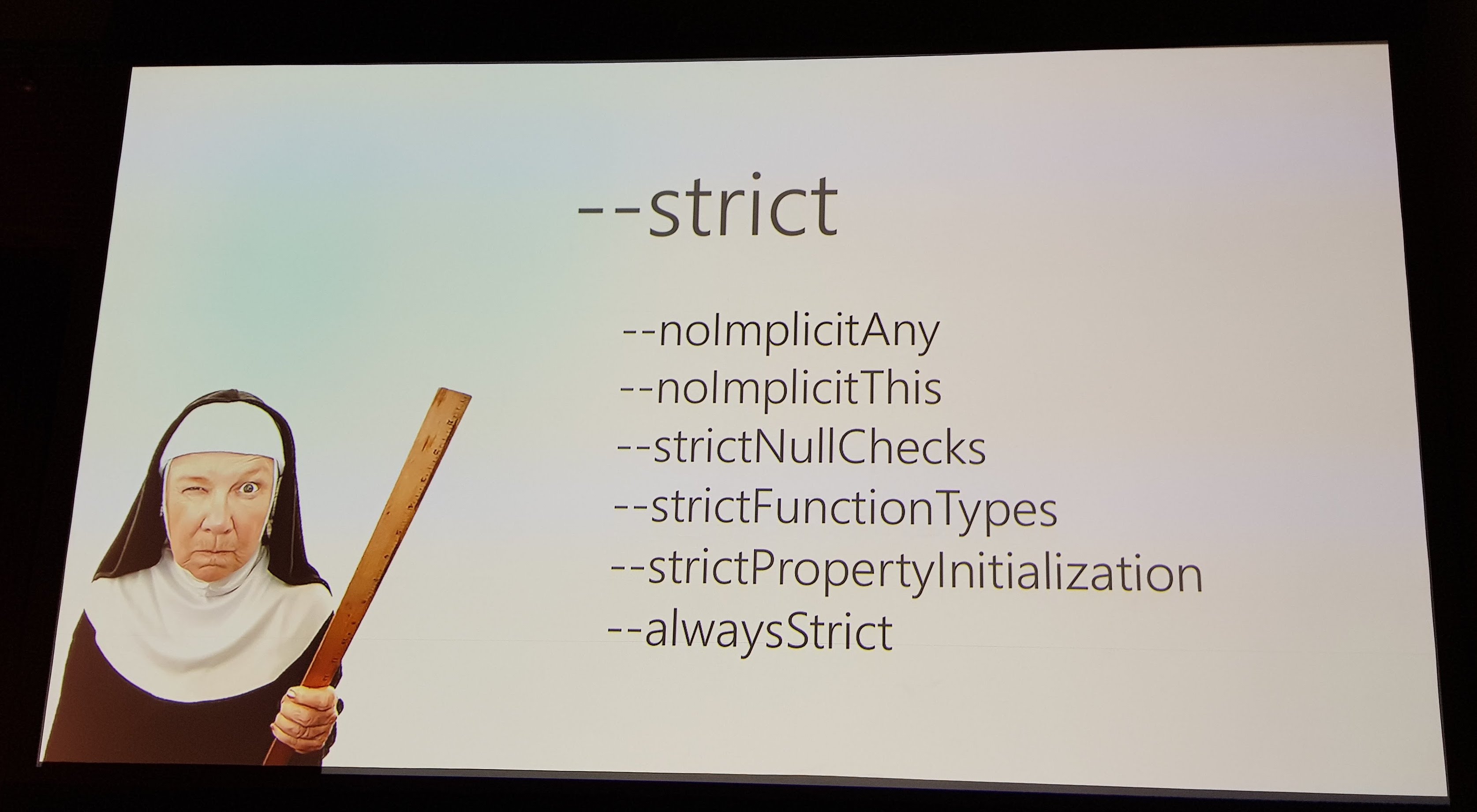 A slide showing a nun with a ruler and talking about strict mode in TypeScript